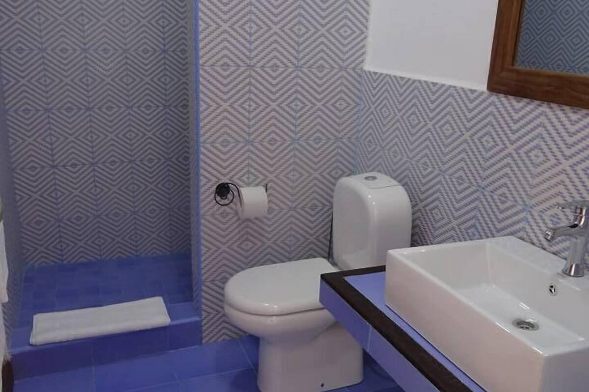 deluxe quadruple room | bathroom | shower, free toiletries, hair dryer, towels