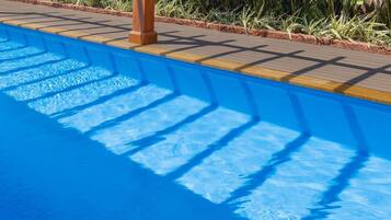 Outdoor pool, pool umbrellas, sun loungers