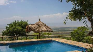 2 outdoor pools, pool umbrellas, pool loungers