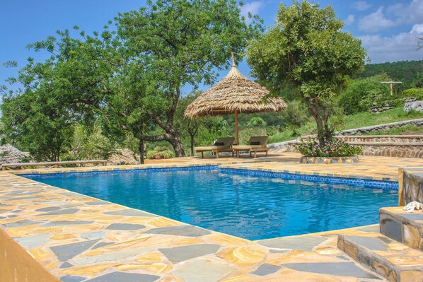 2 outdoor pools, pool umbrellas, pool loungers