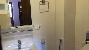 Shower, rainfall showerhead, slippers, towels