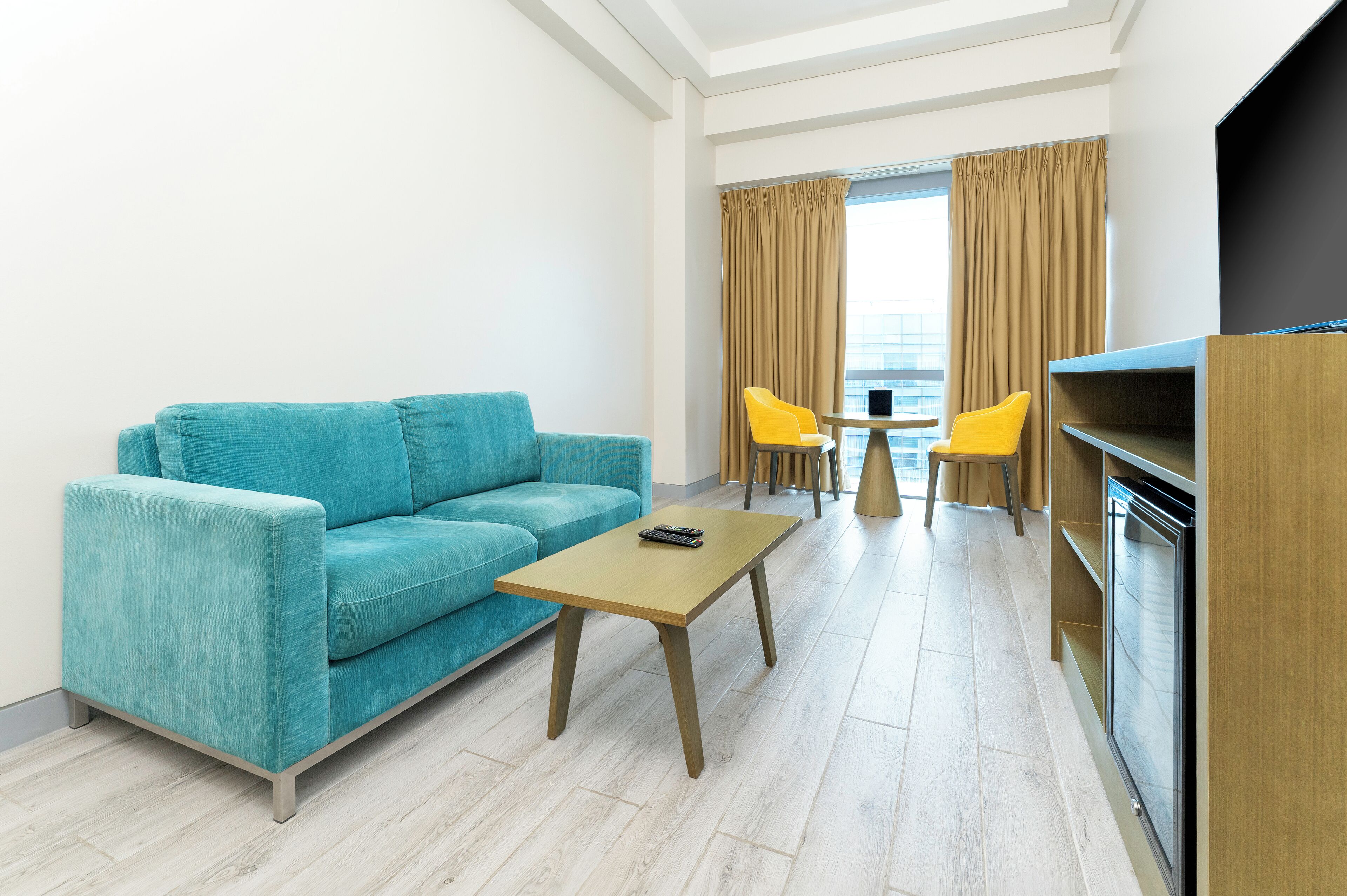 Junior Suite | Living area | 32-inch flat-screen TV with cable channels