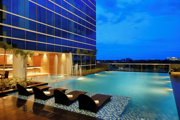 Outdoor pool, open 7:00 AM to 9:00 PM, free cabanas, pool umbrellas