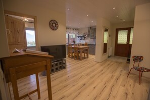 Apartment, 3 Bedrooms | Living area | 120-cm flat-screen TV with digital channels, TV, DVD player