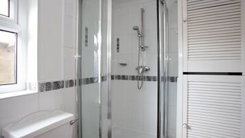 Bathtub, hair dryer, towels, soap