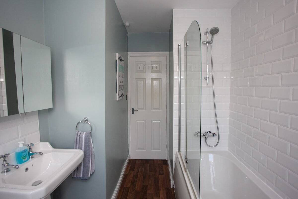 Bathtub, hair dryer, towels