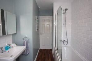 Bathtub, hair dryer, towels
