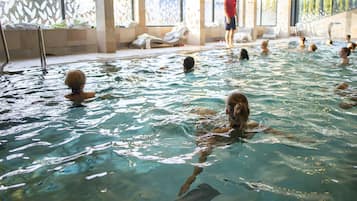 Indoor pool, open 7:00 AM to 9:00 PM, pool loungers