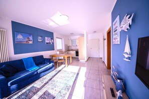 Apartment, 2 Bedrooms | Living area | Flat-screen TV - Lake & Pool (Nago-Torbole)