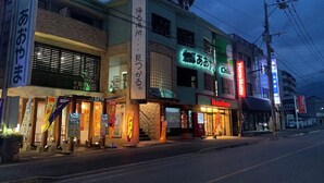 A building with multiple commercial establishments, including a restaurant and a hotel. - AO-Dazaifu (Chikushino)