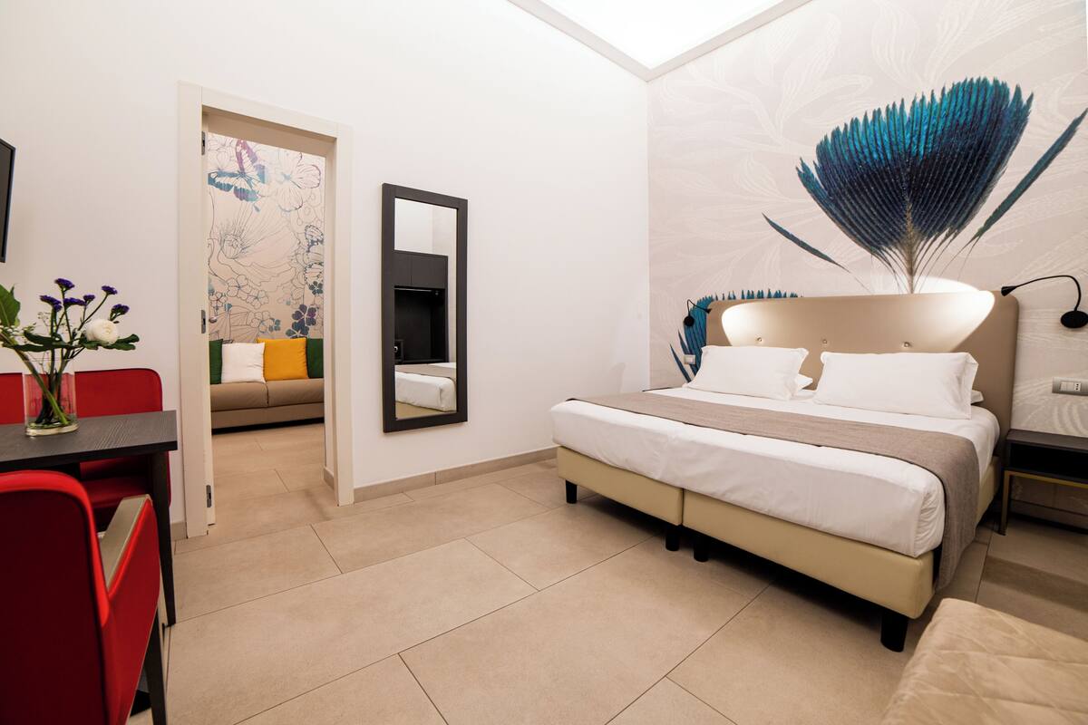 Deluxe Quadruple Room | Minibar, in-room safe, desk, soundproofing