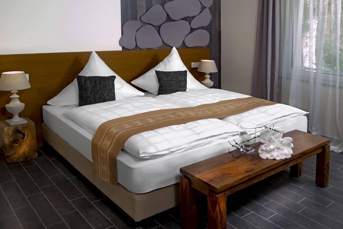 Appart'hôtel Confort | Chambres insonorisées, Wi-Fi gratuit, draps fournis