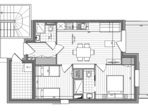 A floor plan of a hotel with a dining area, kitchen, and multiple bedrooms.