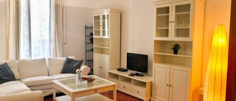 Apartment, 1 Bedroom | Living room | 28-inch TV with satellite channels