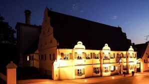 A traditional building with multiple windows and a prominent central tower, likely a hotel or historic building. - Hotel & Brauereigasthof Kapplerbräu (Altomunster)
