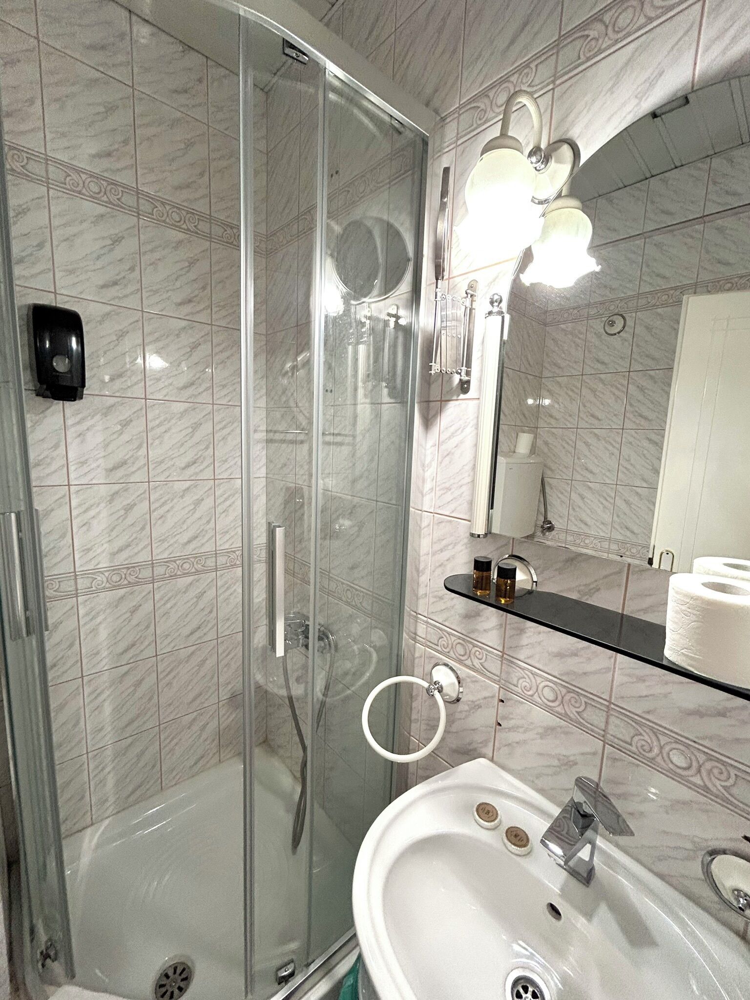 basic double room, city view | bathroom | shower, hair dryer, slippers, towels