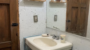Shower, hair dryer, towels, toilet paper