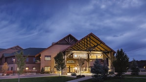 A hotel with a prominent entrance, a sign for 'Wyndham Vacation Ownership', and a 'Glacier Canyon Lodge' sign.