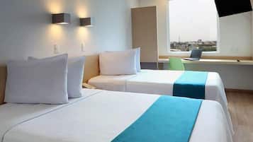 Habitación superior, 2 camas individuales | Escritorio, cortinas blackout, cunas gratuitas y wifi gratis