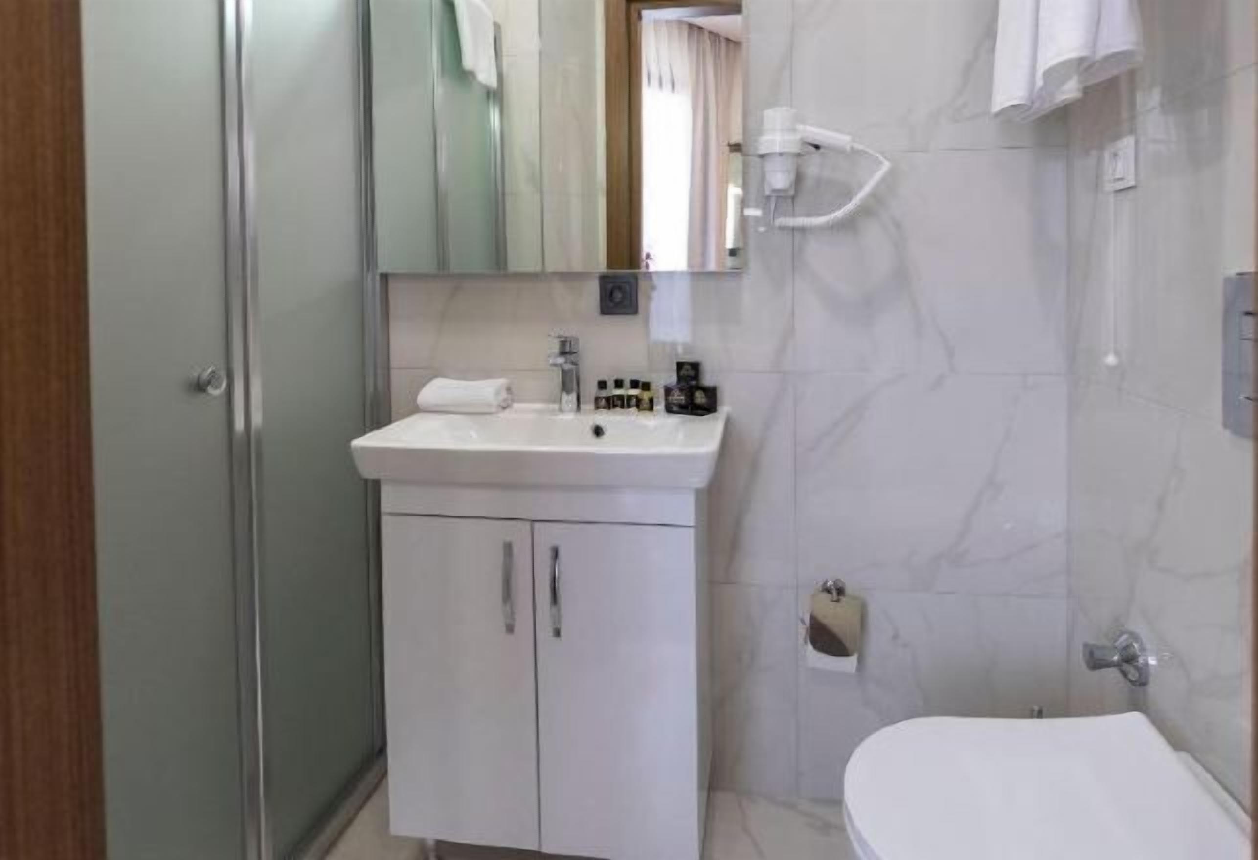 Bathroom | Shower, rainfall showerhead, hair dryer, bathrobes