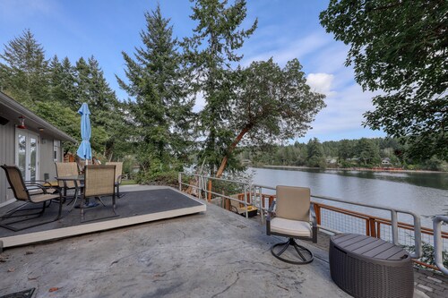Spacious waterfront home with hot tub, large decks, kayaks, and beach access