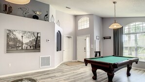 A spacious room with a pool table, a billiards rack, and a billiard cue. - MAGIC 5* LAKE VIEW VILLA HEATED POOL&HOT SPA, near DISNEY, 10 Guests (Kissimmee)