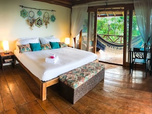 Corner room is an ocean view king size bedroom with a wrap around balcony.