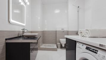 Bathtub, hair dryer, towels, soap