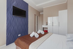 3 chambres, coffres-forts dans les chambres, fer et planche à repasser