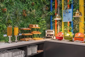 A buffet area with a variety of food items, a coffee station, and a sign promoting classic Chinese dishes. - Holiday Inn Express Shanghai Hongqiao North by IHG (Shanghai)