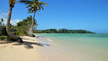 On the beach, sun loungers, beach towels