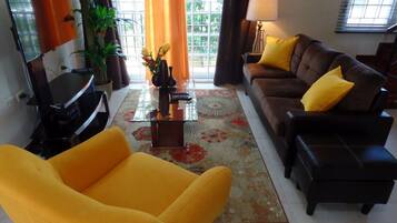 Superior Villa | Living area | 50-inch Smart TV with cable channels, TV, Netflix