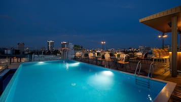 Outdoor pool, open 7:00 AM to 11:00 PM, pool umbrellas, pool loungers