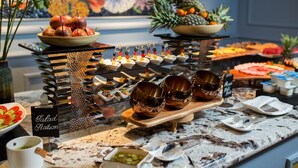 A buffet setup with various food items and a salad station. - Anatole Hotel Hanoi (Hanoi)