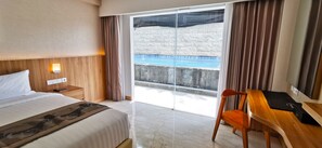 Deluxe Double or Twin Room, Pool Access | Premium bedding, minibar, in-room safe, desk - The Capital Hotel and Resort Seminyak (Seminyak)