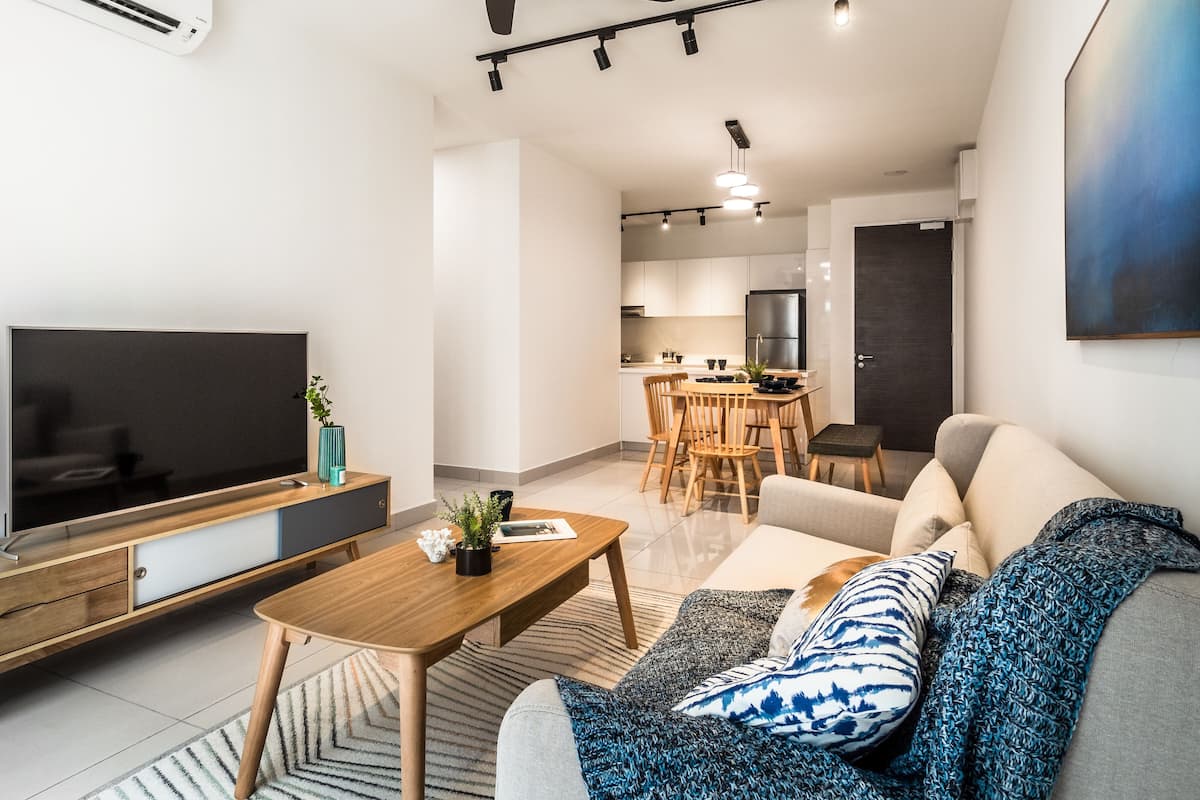 Three Bedroom Apartment | Living room | 50-inch Smart TV with digital channels