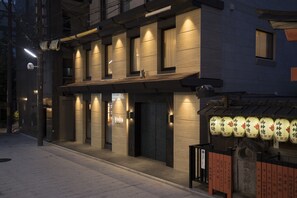A modern building with a sign reading "yoin" and traditional lanterns. - Yoin Hotel Kyoto Gion (Kyoto)