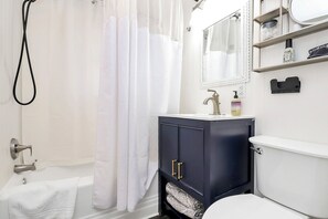 Combined shower/bathtub, hair dryer, towels, soap