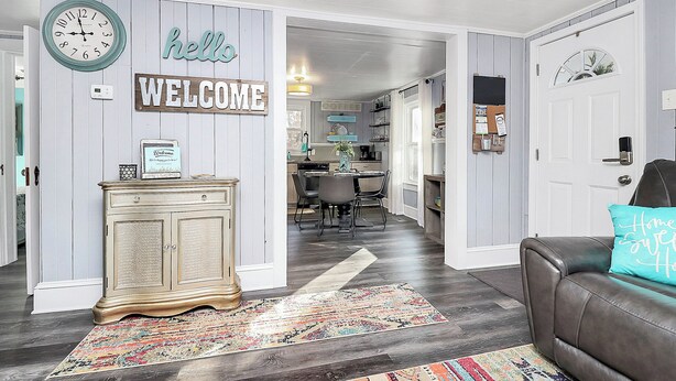 A home interior with a living room, dining area, and kitchen. - Lake Norman Shabby Chic bungalow in Cornelius close to Davidson (Cornelius)