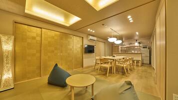 Family Suite | Living area | Flat-screen TV, first-run movies