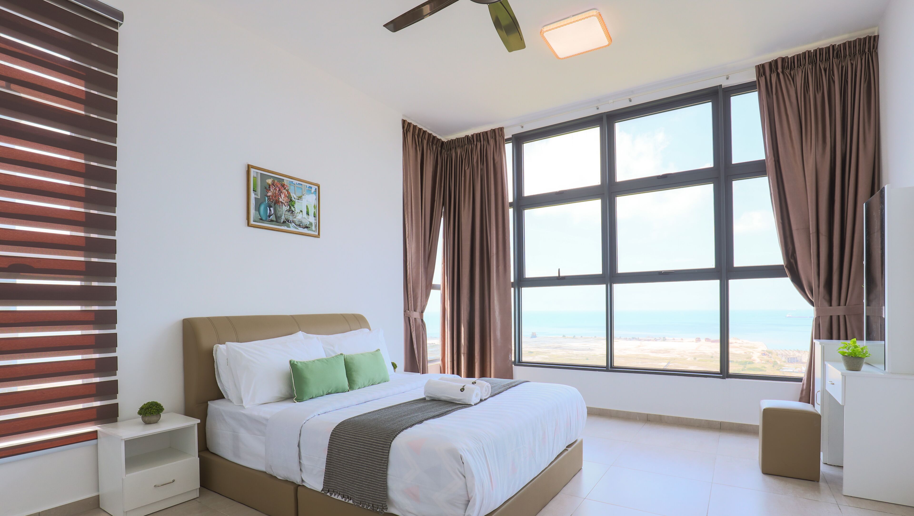 Premium bedding, laptop workspace, blackout curtains, soundproofing