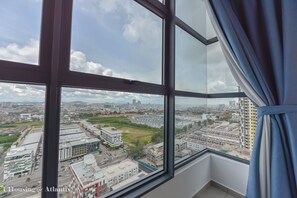 A high-rise building with a large window and curtains. - Atlantis Executive Melaka by I Housing (Malacca City)