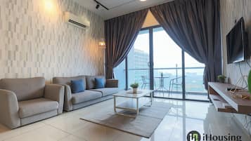 Standard Apartment, 1 Bedroom | Living area | 40-inch Smart TV with digital channels, Netflix, ping pong