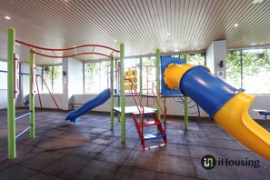 A playground with slides and climbing structures. - Atlantis Executive Melaka by I Housing (Malacca City)
