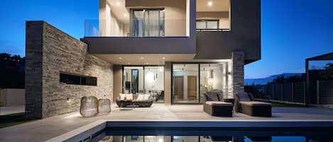 Outdoor pool, a heated pool, sun loungers