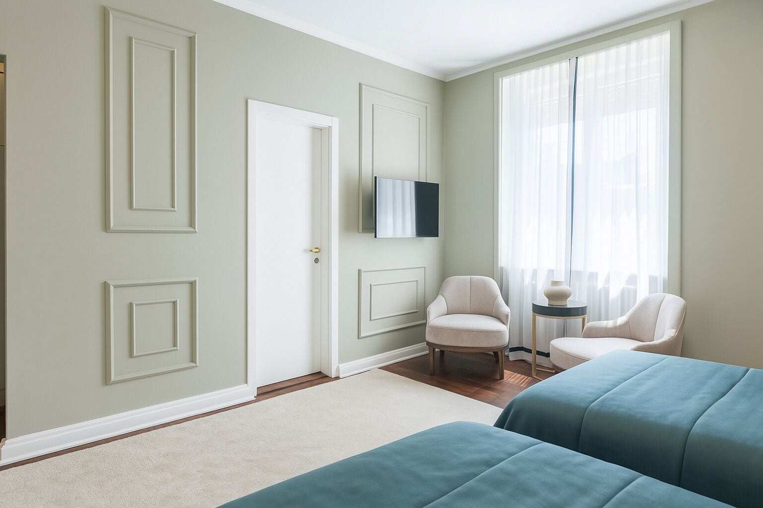A room with two beds, a television, a chair, and a window with curtains.