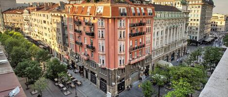A multi-story building with balconies, a central courtyard, and a mix of architectural styles.