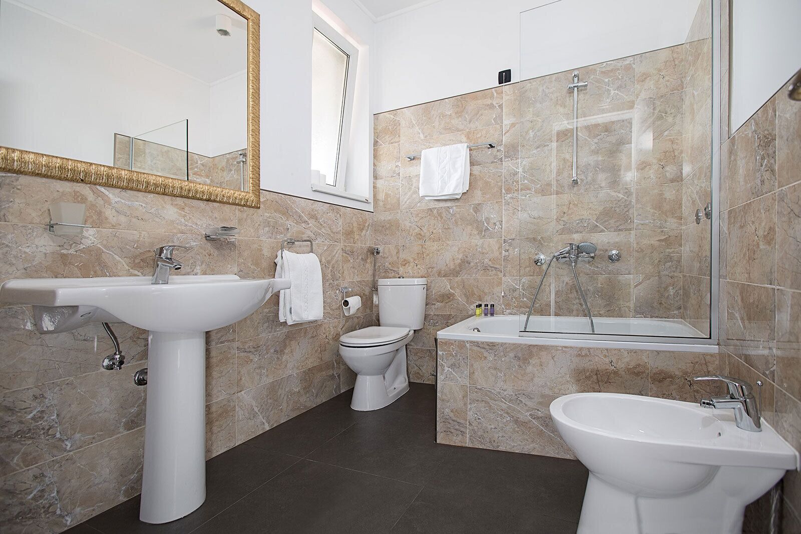 free toiletries, hair dryer, slippers, bidet