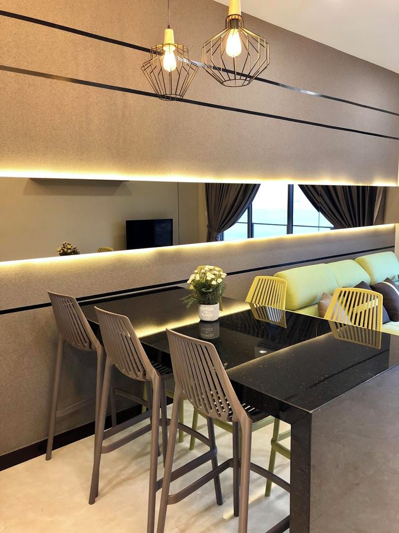 A modern dining area with a black table, four chairs, and a vase of flowers.