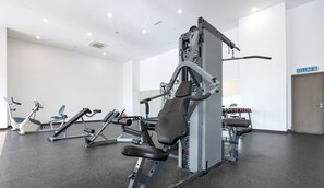 A gym with various exercise equipment, including treadmills, stationary bikes, and weight machines. - Silverscape Executive Melaka by I Housing (Malacca City)